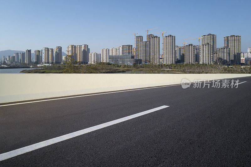 city ​​buildings beside asphalt road